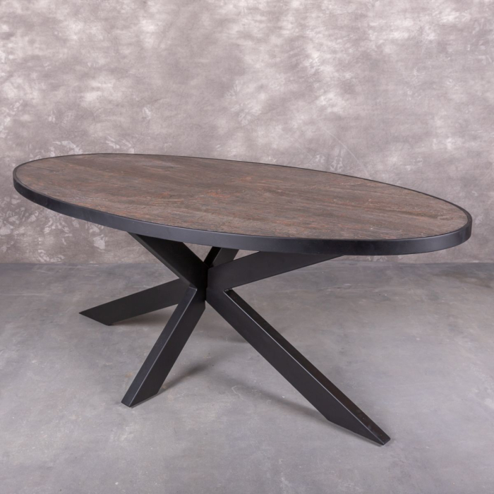 Eettafel steen fineer. Ovaal met zwarte spinpoot